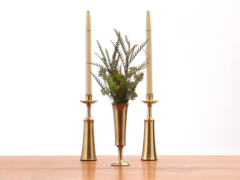 Bronze candlesticks that can be inverted and also used as a vase. All pieces bear Dansk makers mark. Sold in sets of two.