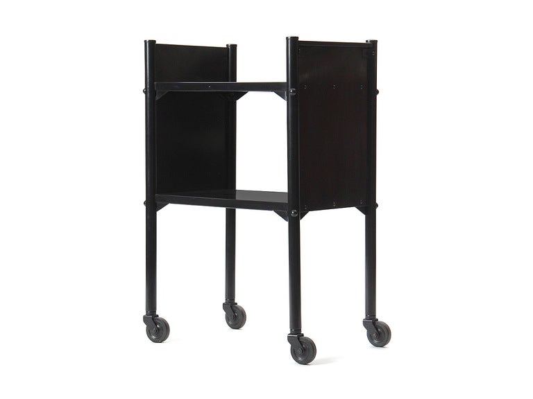 A simple steel cart with two tiers for bar, library, or living room use.