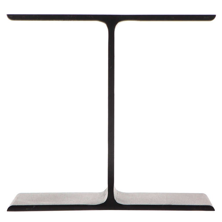 A uncommon and sublimely minimalist pedestal, side table or coffee table in the form of truncated I-beams fashioned of blackened steel. The I-beams can be left bare or topped with glass or stone.