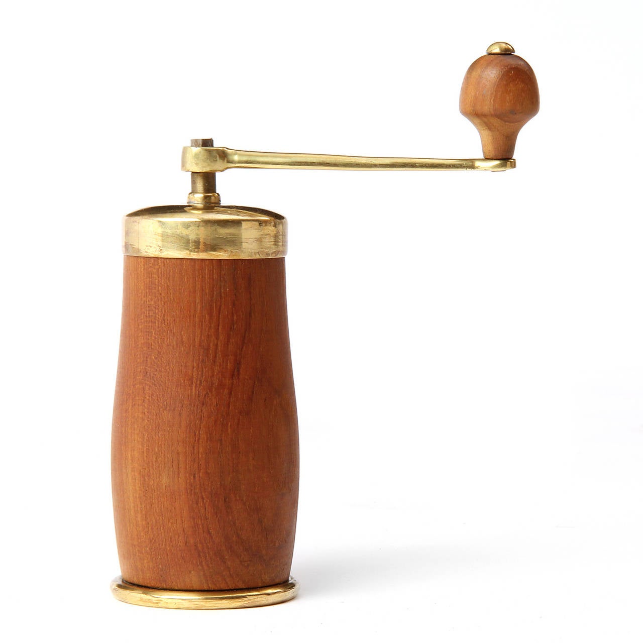 An elegant and sculptural coffee mill crafted of solid teak and lacquered brass.