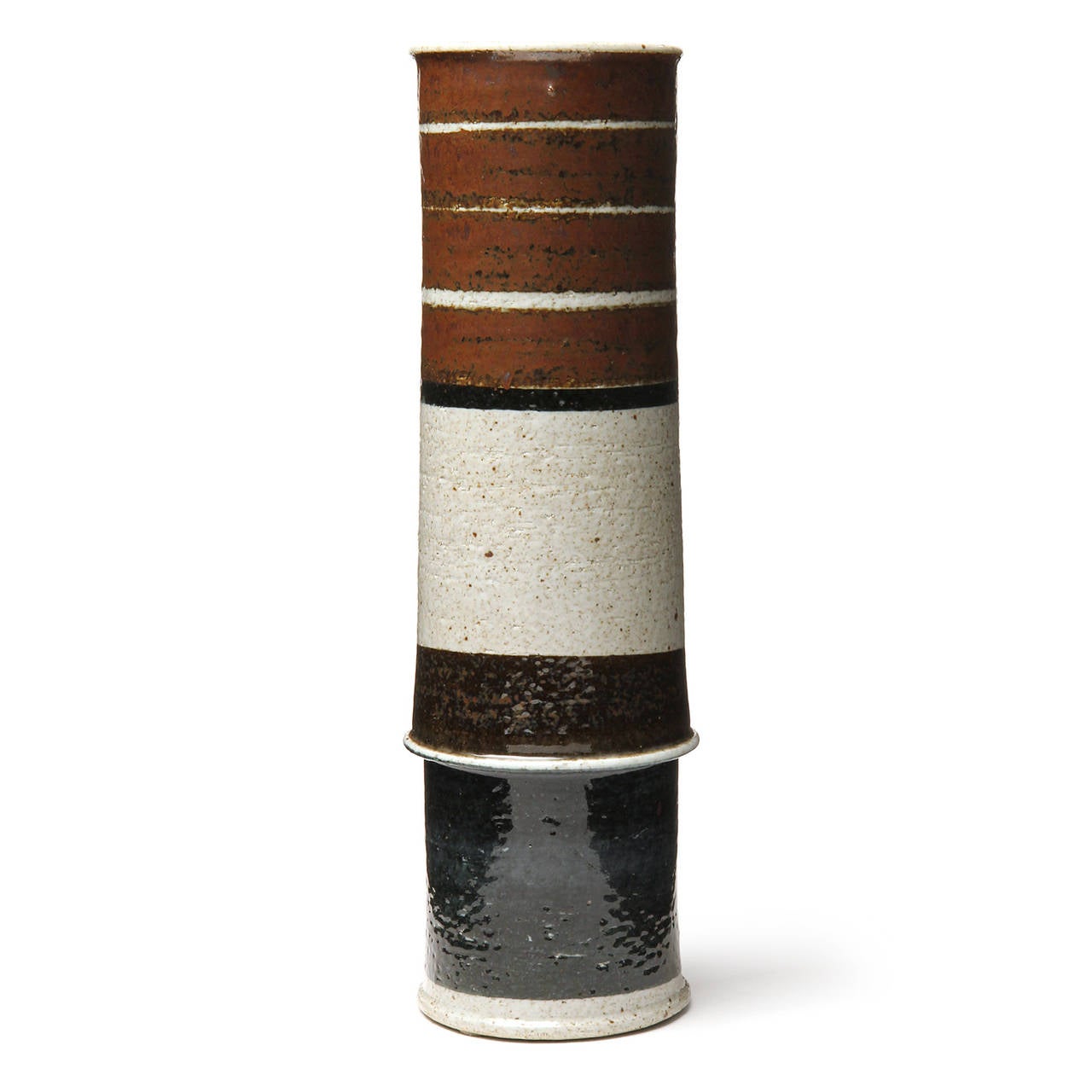 A substantial, well-scaled and impeccable unique studio stoneware vase having a tall, cylindrical and sculptural form decorated with expressive earth toned glazed bands of color.
