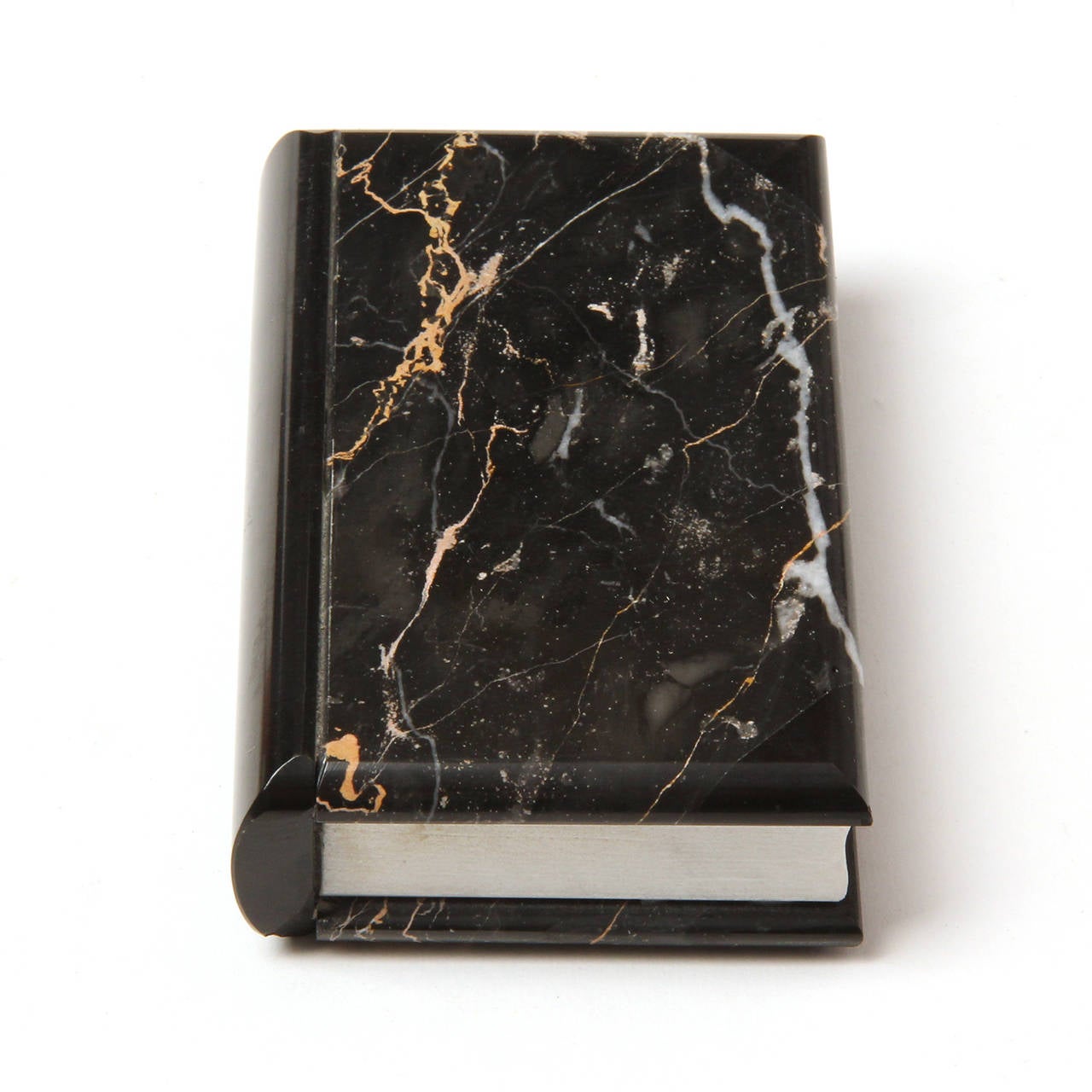 An expressive and superbly executed trompe l'oeil book crafted entirely of marble.