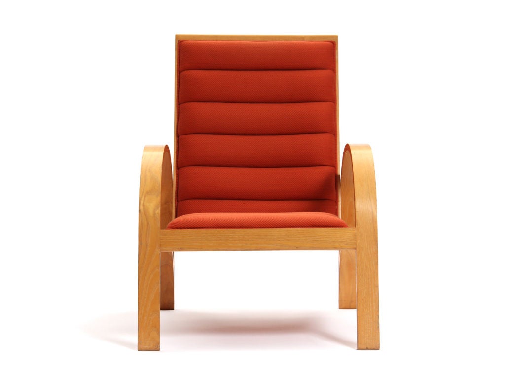A solid ash lounge chair with adjustable recline and original channeled upholstery