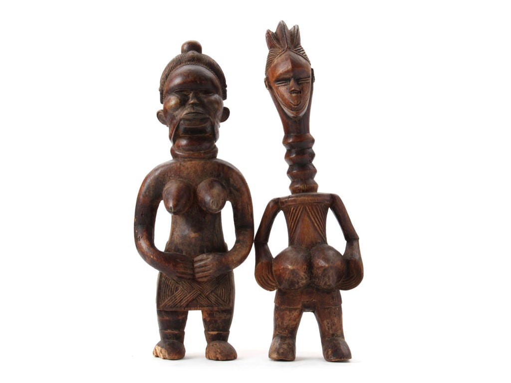 A 'Mende' carved wood male and female fertility figures.