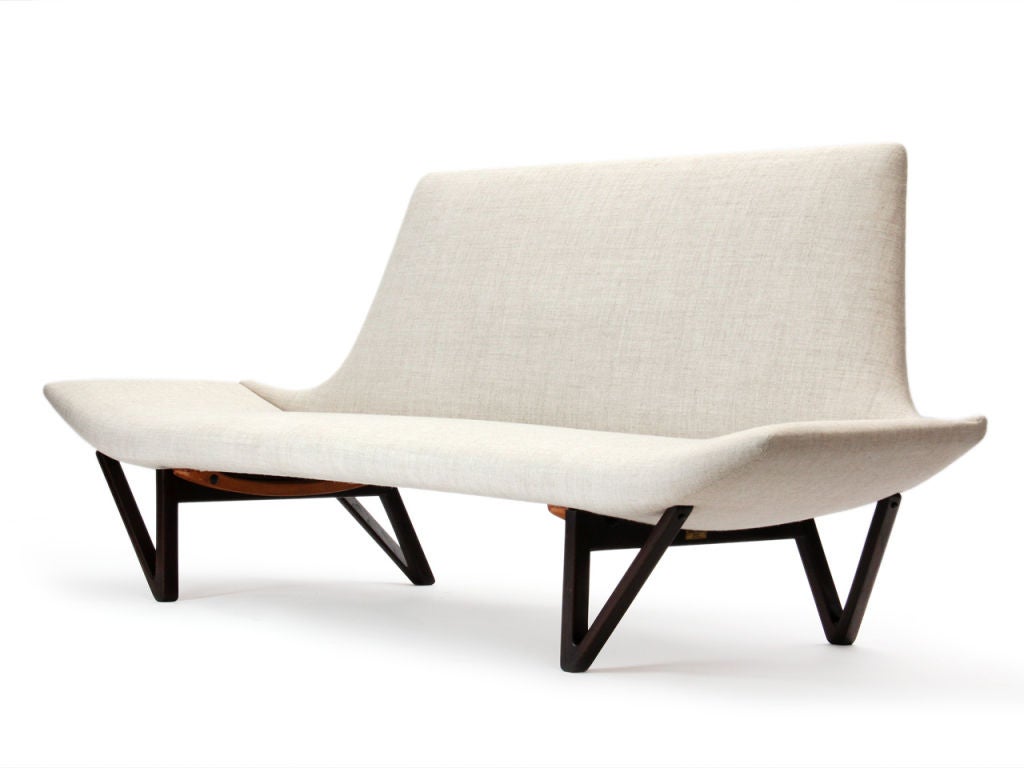 An armless sofa with exposed architectural V-shaped teak legs. Design by  Edvard and Tove Kindt-Larsen, produced by Cabinetmaker Thorald Madsens.

PHOTO for reference, requires upholstery.