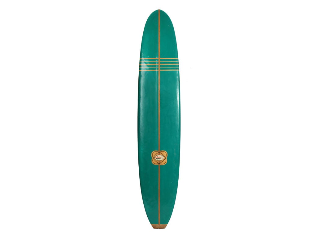 A long green surf board by Greg Noll Surfboards.