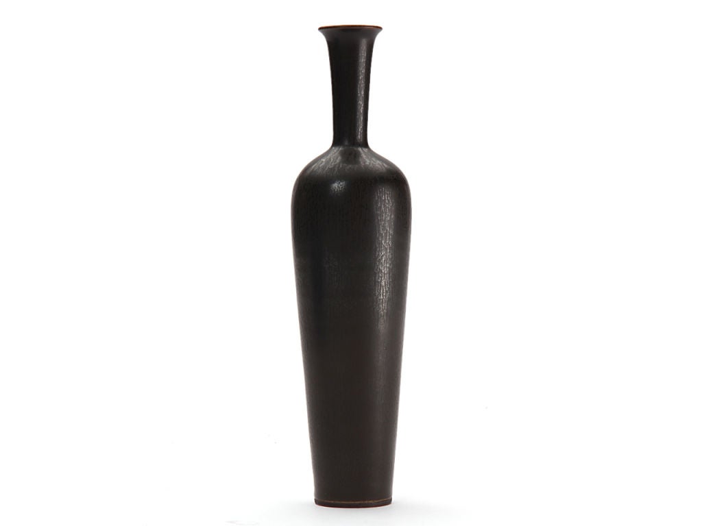 A ceramic vase with blue 