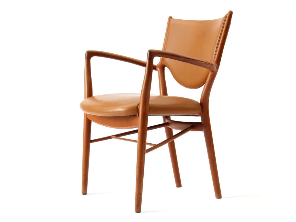 A Scandinavian Modern sculptural and early production '46' armchair in teak and tan leather designed by Finn Juhl. Made by Niels Vodder in Denmark, circa 1940s.

Finn Juhl was first and foremost famous for his furniture before working with