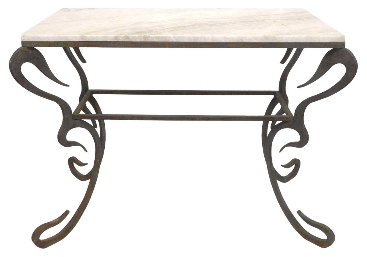 An incredible, custom-made console of cut plate-steel with a warm-white, quartzite top. Procured from the estate of legendary record executive Mo Ostin, this console exhibits beautiful, highly-stylized ornamentation evoking an organic, Art Nouveau