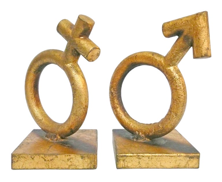 A playful and graphic set of gender symbol bookends by Curtis Jere. 
Heavy iron forms with a gold leaf surface. Signed and dated 