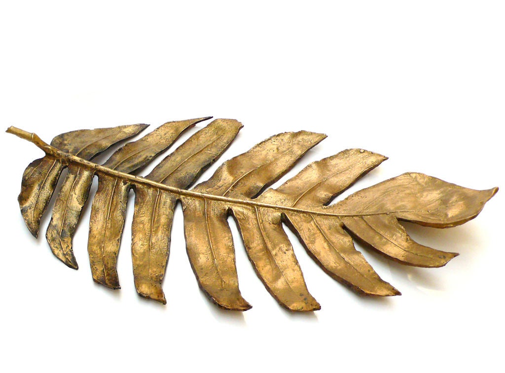 Naturalistic large cast bronze tropical leaf with deep patina.