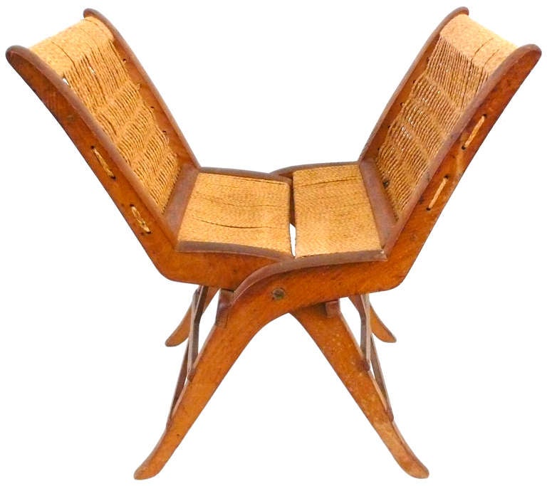 An elegant and unusual 1940's Italian folding stool with original rushed cord seat. A fantastic, graphic form with great character and decorative presence.