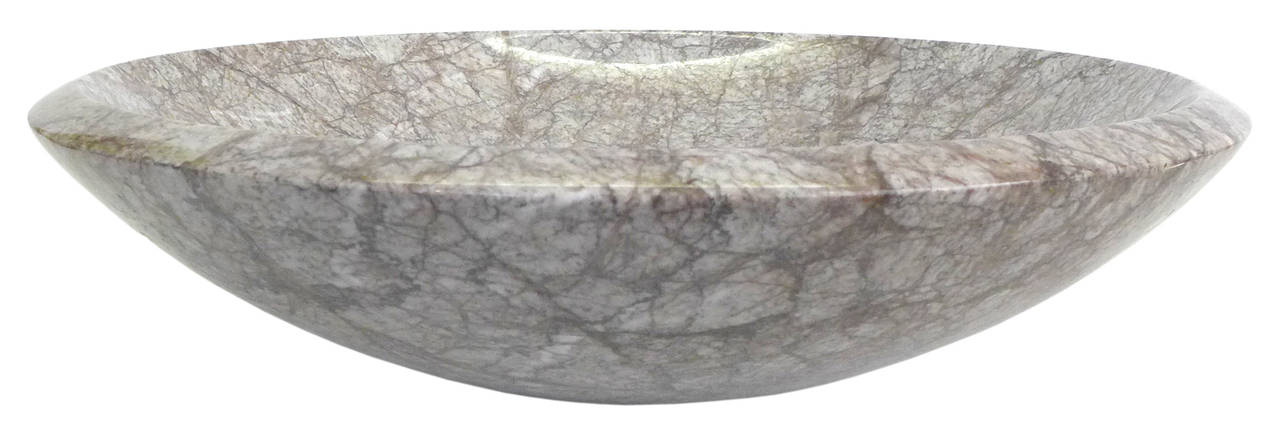 An exceptional marble centerpiece bowl by magnate of Italian architecture and design, Angelo Mangiarotti. Impressive form and scale with wonderful figuring throughout and a beveled edge at the perimeter. A utilitarian piece with powerful decorative