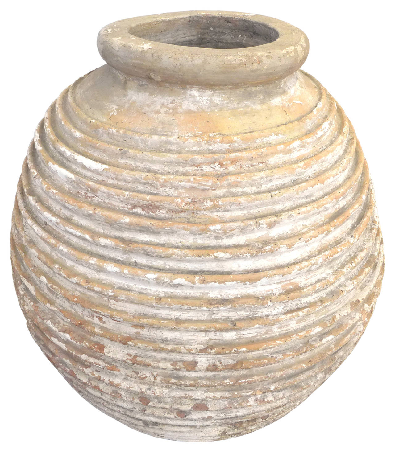 An exceptionally large and beautiful terracotta vessel original used in Greece to transport and store olive oil. A beautiful beehive form with fantastic surface wear and patina. A magnificent Mediterranean form with huge decorative presence.