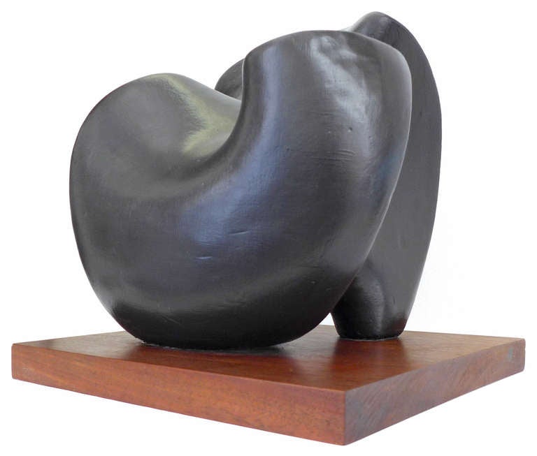 A fantastic cast and carved plaster sculpture mounted to its original wooden base. A spectacular modernist and biomorphic form with a painted surface, implying bronze. Beautifully executed and interesting from all angles. Signed illegibly in pencil