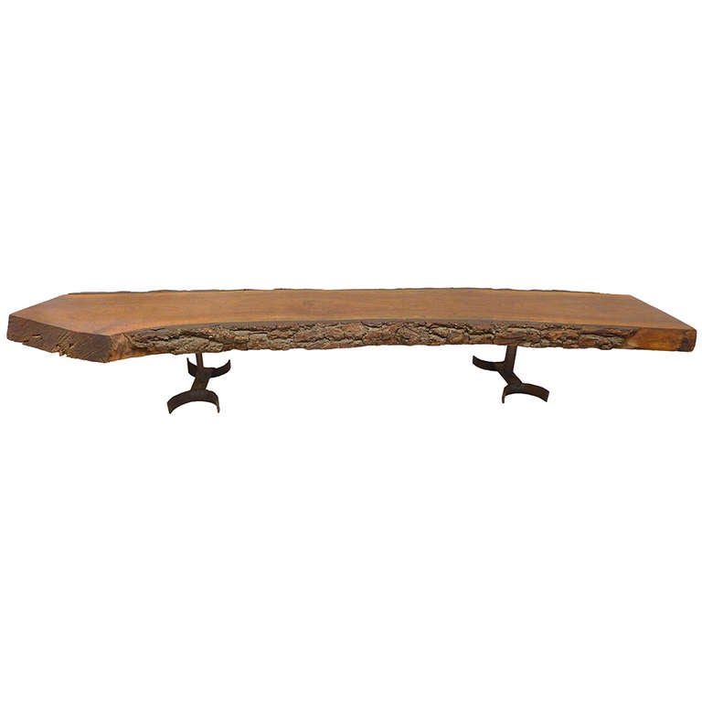A wonderful and massive thick slab wood table by Allentown, Pennsylvania architect, Donald Dunkley. Created by the architect in 1963 for his own home, this magnificent wooden free-edge slab retains its original bark edge and sits upon a pair of