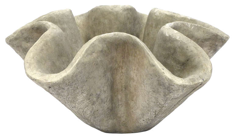 A large and sculptural cast concrete planter with a wonderful patina. A beautifully undulating and organic form with great scale and mass. This mid-century French garden accessory has great decorative character and could work either indoors or out.