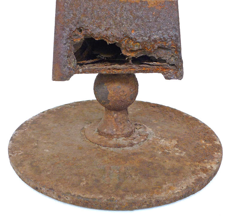 A beautifully geometric and totem-like birdbath made of iron and copper. A strong, sculptural form with a spectacular patina and great decorative presence. Likely an artist made piece with a signature symbol in relief on its base.