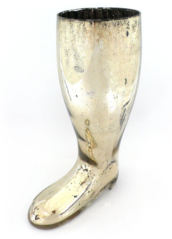 Unusual mercury glass vase in the form of a boot. Fantastic patina and wear give this piece exceptionally great decorative character. An interesting figural object for either a traditional or modern interior. Retains original paper export labels.