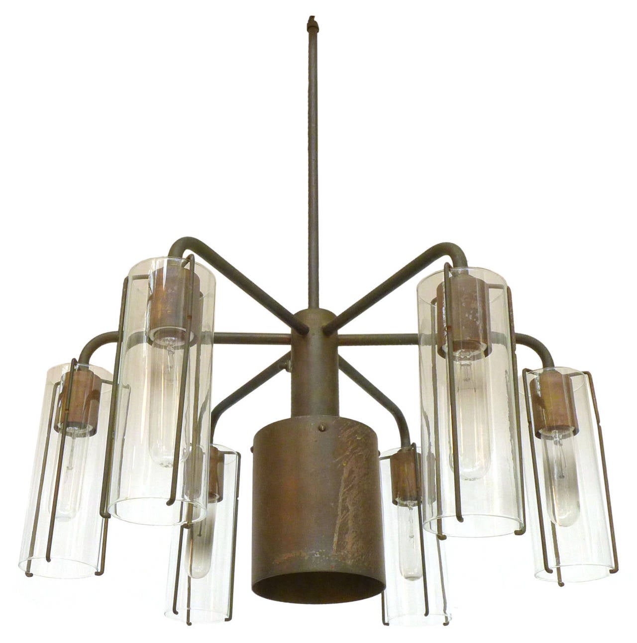 An elegant and modernist bronze and glass chandelier designed by Stuart Barnes for Robert Long, Inc. This dramatic fixture has a rich patina, one central recessed downlight and six additional lamps housed in the original glass hurricane shades. A
