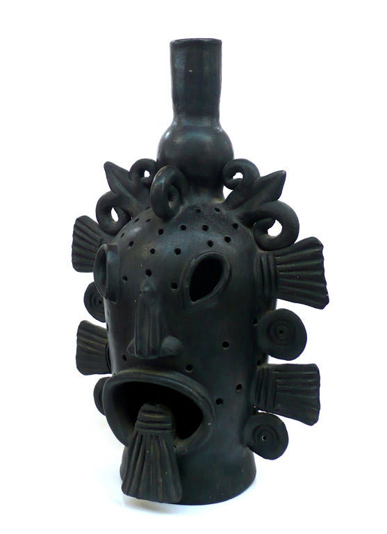 Fantastic bust of a Mexican mythological or religious figure from Oaxaca, Mexico. This handmade ceramic figure has great sculptural presence but can also easily be wired and used as a lamp. A striking and unusual piece of Mexican mid-century design.