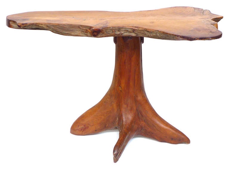 A fantastic, free-edge, wood side table by New England artisan Francis Barrington.  An elegant coupling of a wood-slab top with a beautifully-carved, splayed root-structure for feet.  The underside exposes the terrific, crude-but-effective steel