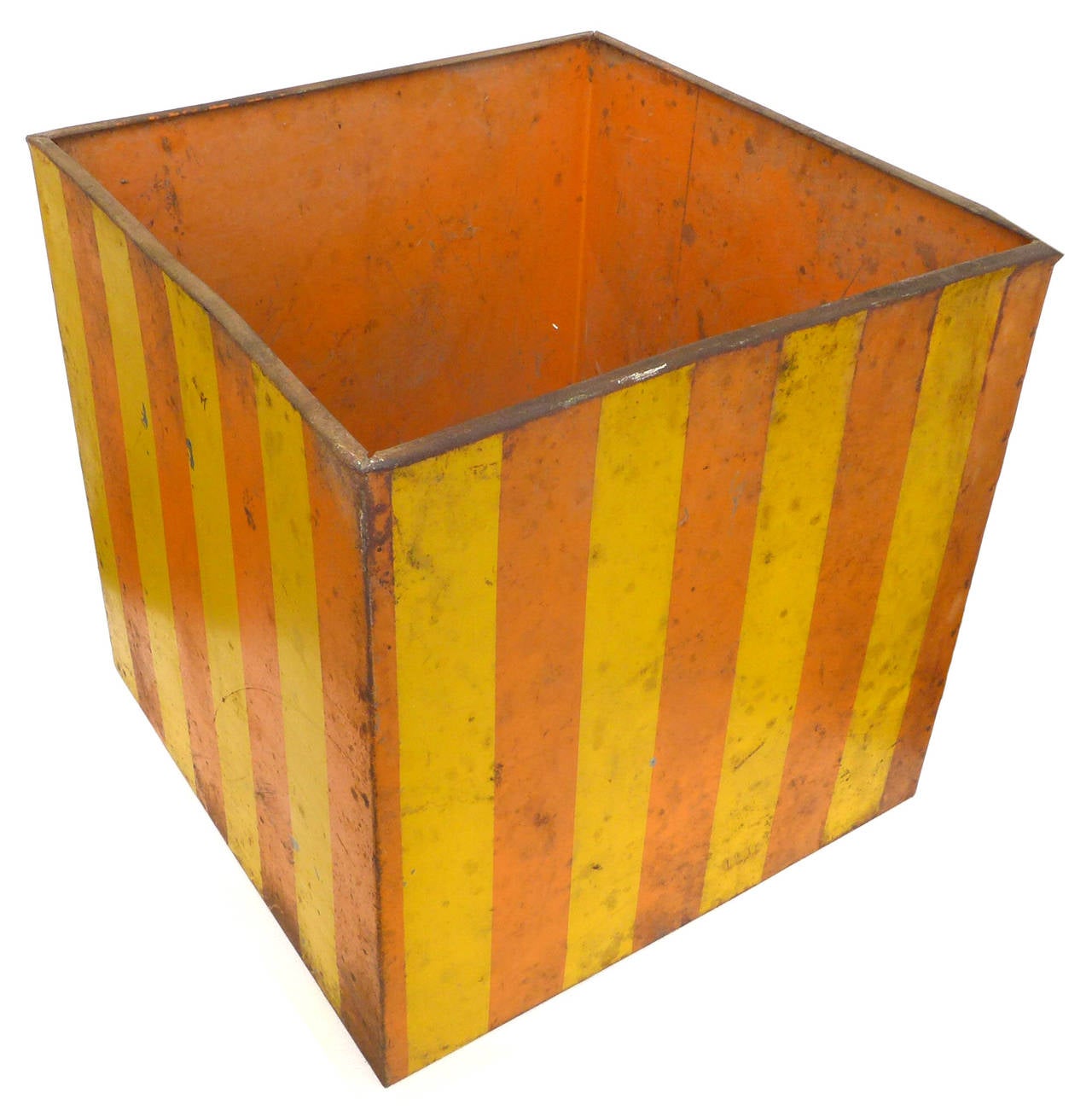 A wonderfully graphic and unusual painted metal box planter that was used by Tony Duquette in one of his Los Angeles interiors. Alternating vertical stripes of orange and yellow create a strong visual effect. Fantastic patina and surface loaded with