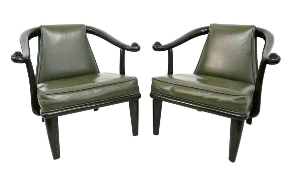 Beautiful pair of armchairs designed by Maurice Bailey for Monteverdi-Young. Wonderfully stylized and elegant with a modern take on an Asian design. Original olive green leather and optional castors. Two pairs available.
