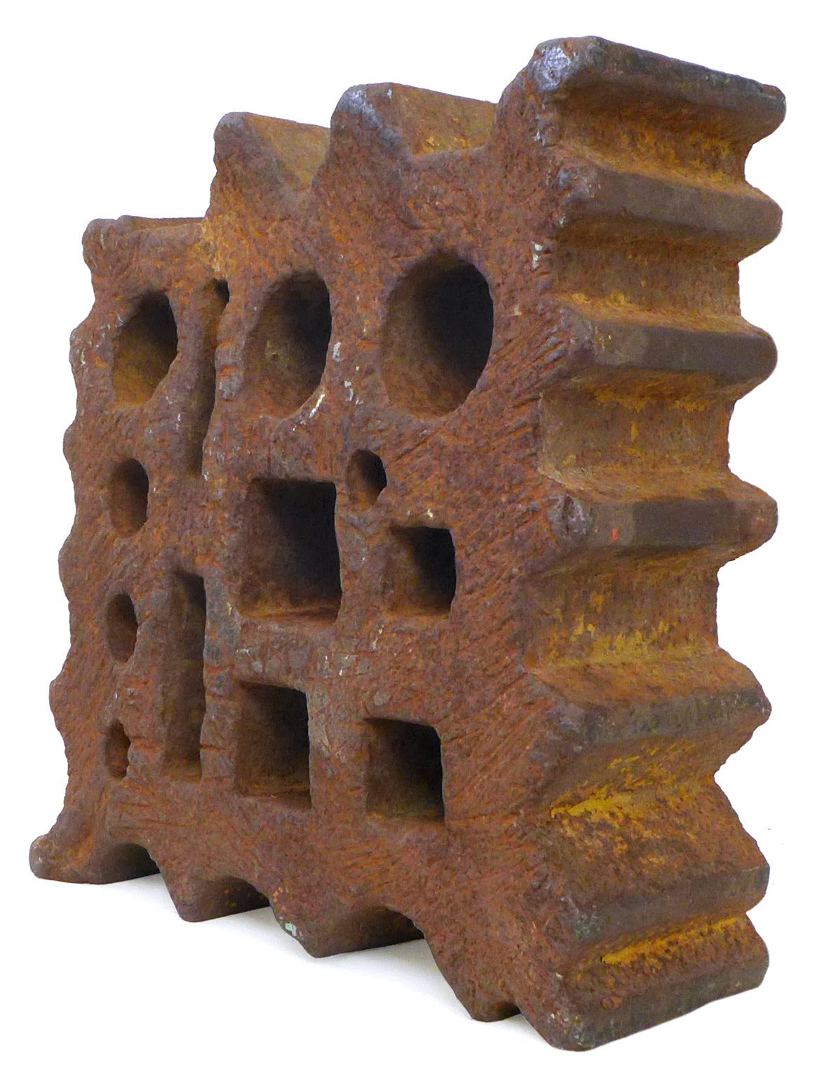 A striking, beautifully- and heavily-worn, cast iron, metalworker's swage.  An alluring, industrial artifact of multiple, geometric perforations framed by varied, irregular contours; amazingly abused and utterly oxidized.  Though industrially made