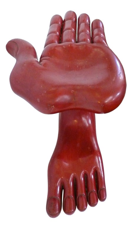 A fantastic and very rare example of Pedro Friedeberg's surrealist, carved furniture. A very unusual flat, hand-foot chair in carved Mexican mahogany with a beautifully worn and patinated lacquered finish. Signed with hand-carved signature 