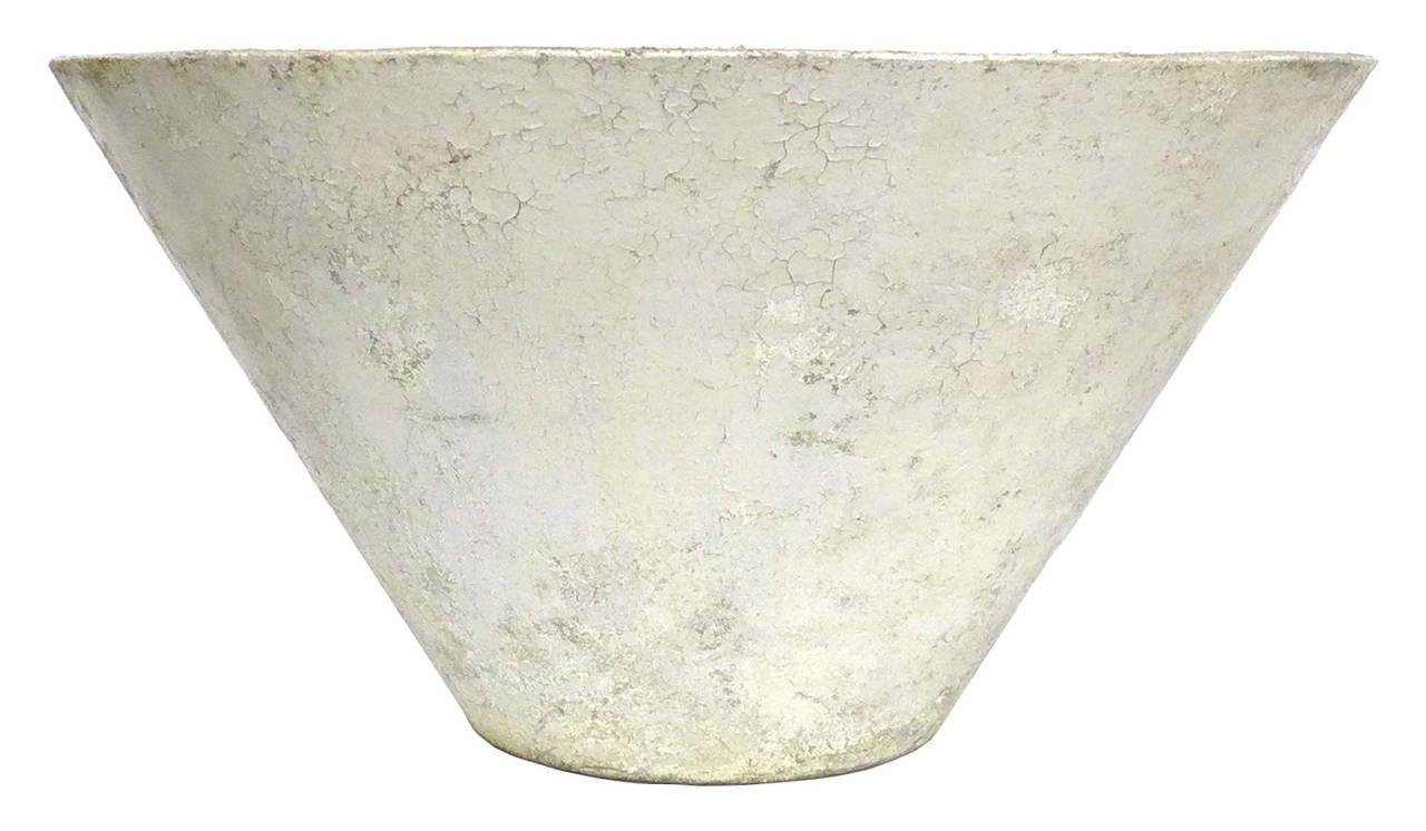 Wonderfully simple and elegant cast concrete planter.  After Willy Guhl, thickly-walled, inverted cone retaining original white paint.  Wearing a much-desired, distressed patina from years of life outdoors, beautiful and architectural garden