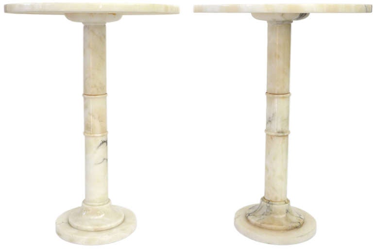 A beautiful pair of neoclassical marble side tables. Very minimal and austere in form with great scale and proportions. Grey veining details in the marble produce a rich accent for these very decorative and versatile side tables.