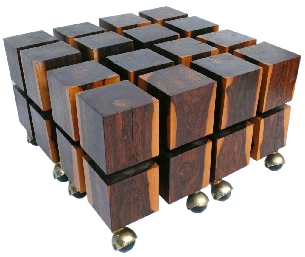 Fantastic set of four individual rolling cube tables, each constructed of eight individual, solid tropical wood cubes connected by brass rods. Each cube cluster is on it's original set of four rolling casters and when grouped together, create a