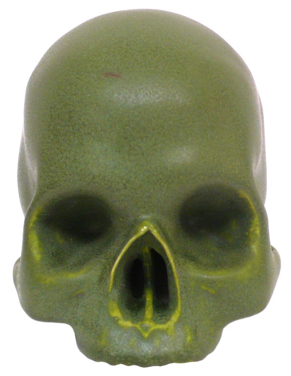 Alas, poor Yorick . . . . A wonderful and unusual life-sized human skull with a beautiful, matte green glaze. An excellent casting with great detail. A fantastic desk accessory.