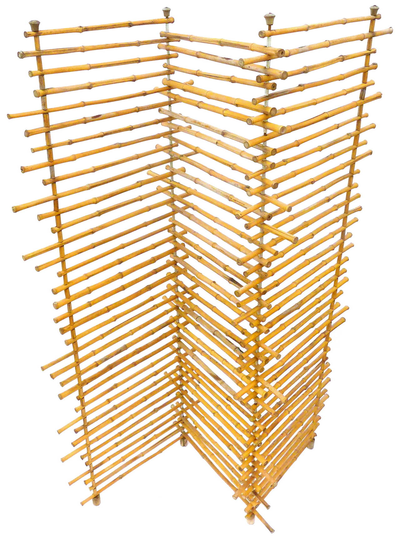 A fantastic three-paneled, adjustable, bamboo screen. A likely handmade piece featuring bamboo stalks of interestingly varied length and wood caps or feet.  A wonderful decorative accessory for delineating environments without being overly