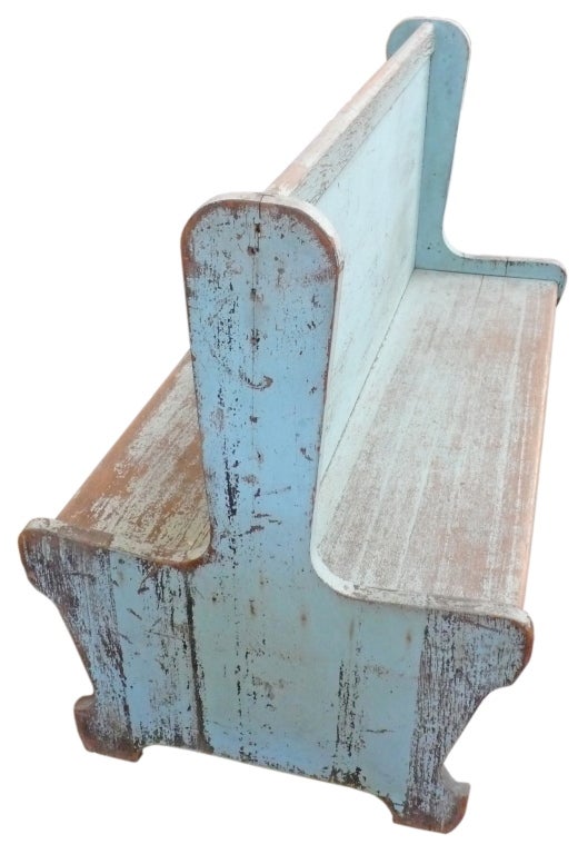 A beautiful, double-sided train station bench from the early 20th Century in original, robin's egg blue paint. An unusual and graphic form with great character and patina. An all-original and wonderful example of Americana.