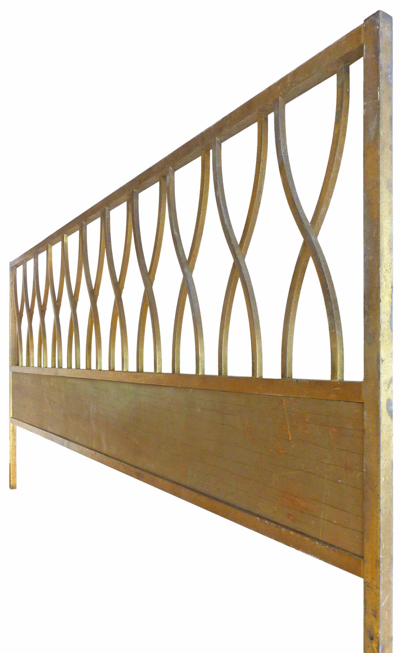 An elegant, king-size headboard of square brass tubing.  A wonderfully simple, repeating linear-pattern of undulating x's exhibiting nice decorative geometry and subtly graceful aesthetic.  A much desired, even patina throughout.  An exceptional