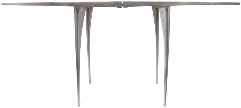 A very elegant and sculpture console table designed by Bob Josten. An unusual and rare Series 1 design, beautifully constructed of cast aluminum. A striking split-top form with a wonderful, warm patina and interesting ribbed legs.