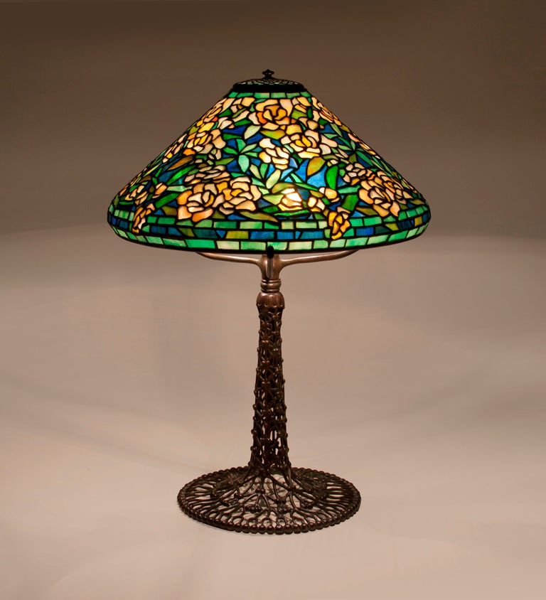 A Tiffany Studios leaded glass and bronze lamp comprising a 