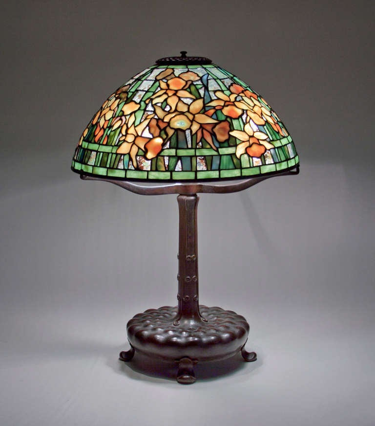 This Tiffany Studios Lamp comprises a leaded glass shade in the 