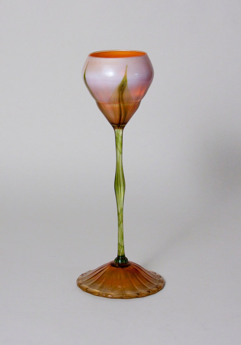 An early tall Tiffany Studios favrile glass flower form vase with decorated cup, signed.