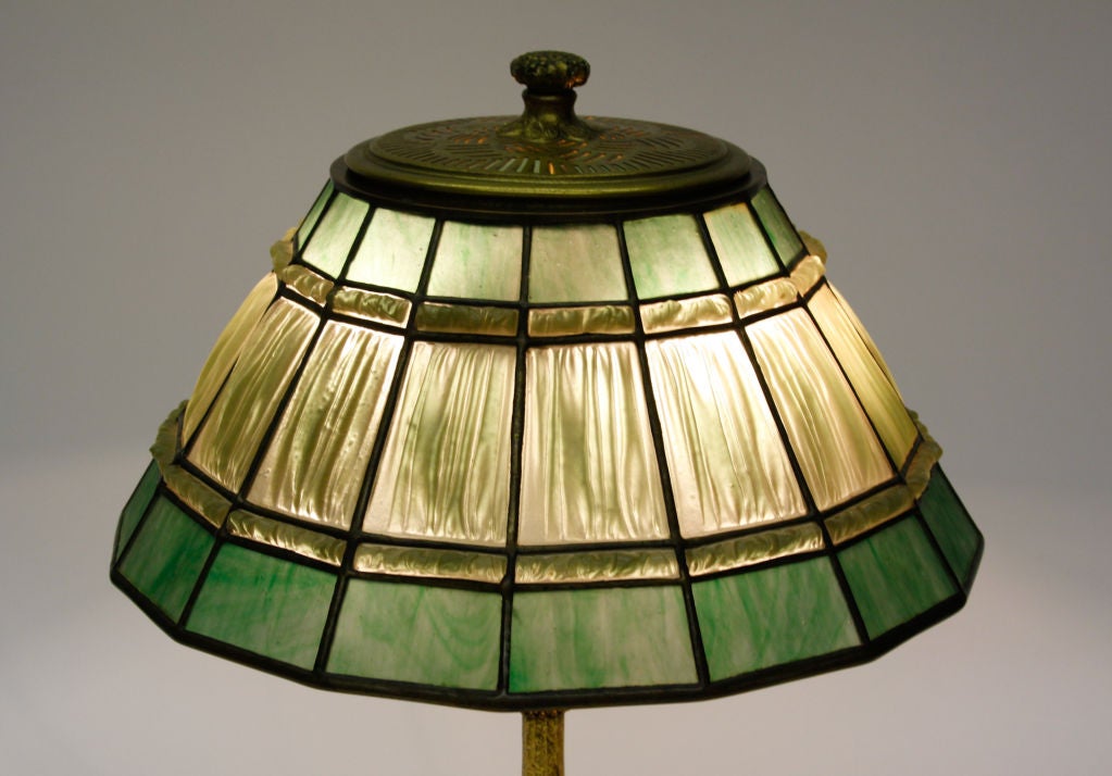 Tiffany Studios green linenfold lamp, signed and with an etched dore patina on the base.