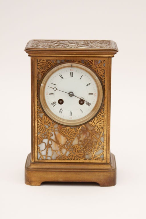 Tiffany Studios etched metal and glass mantel clock in the 