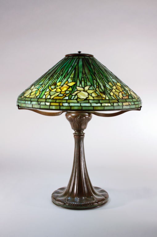 A Tiffany Studios leaded glass and bronze table lamp comprising a 