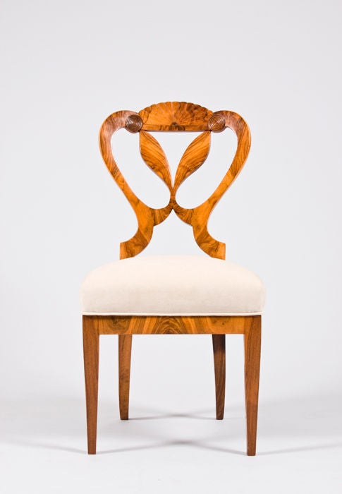 A pair of two exceptional Biedermeier chairs attributed to Josef Danhauser. Carved massive walnut with walnut veneer<br />
<br />
39.0