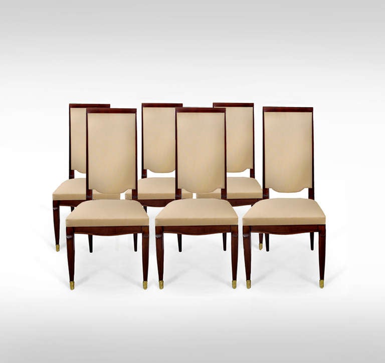 A striking set of six Art Deco dining chairs by Maurice Jallot. Solid French walnut, with brass sabots. Available en suite with matching dining table. 