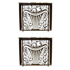 An Exceptional Pair of Art Deco Iron Console Enclosures