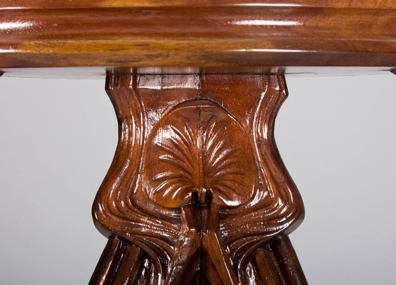 Solid mahogany, with finely carved vegetal forms.
France, circa 1900.