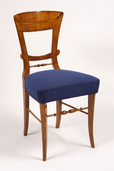 A pair of Biedermeier side chairs, in cherry veneer with mahogany inlays