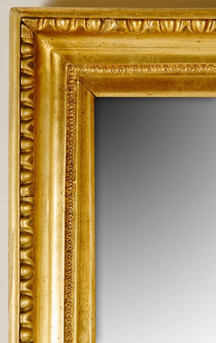 A neoclassical mirror.

Carved and gilded linden wood with egg and dart ornament,

Austria, first quarter of the 19th century.